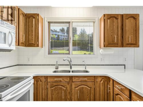 509 Crestview Drive, Coldstream, BC - Indoor Photo Showing Kitchen With Double Sink