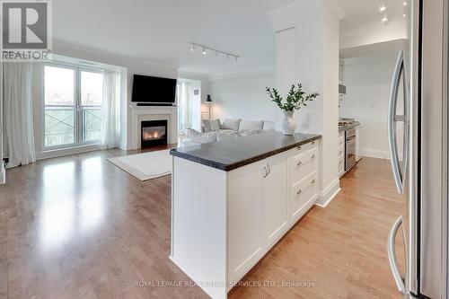 313 - 20 Scrivener Square, Toronto, ON - Indoor With Fireplace