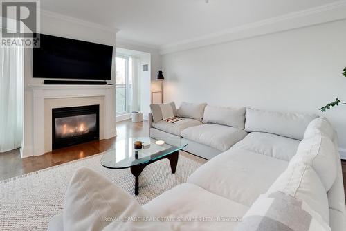 313 - 20 Scrivener Square, Toronto, ON - Indoor Photo Showing Living Room With Fireplace