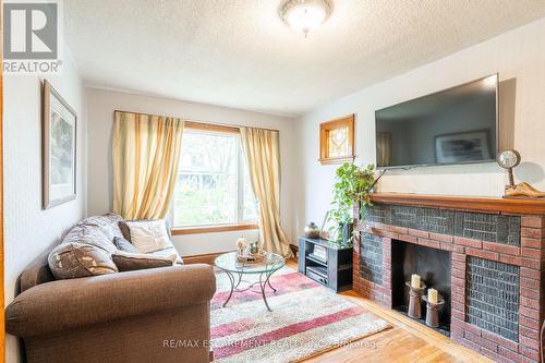 90 Graham Avenue S, Hamilton, ON - Indoor Photo Showing Living Room With Fireplace