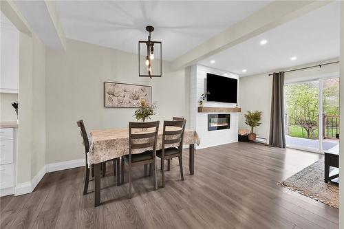 125 Livingston Avenue|Unit #16, Grimsby, ON - Indoor Photo Showing Dining Room With Fireplace