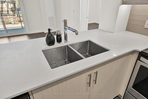 312 - 320 Plains Road E, Burlington, ON - Indoor Photo Showing Kitchen With Double Sink