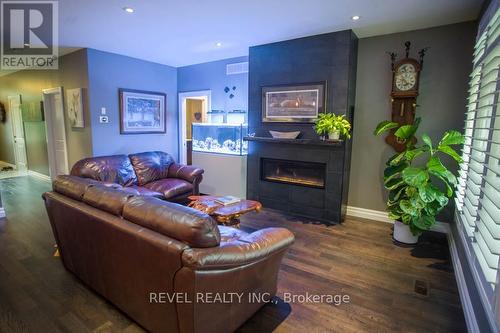10 - 23 Cedar Street, Brant, ON - Indoor Photo Showing Living Room With Fireplace