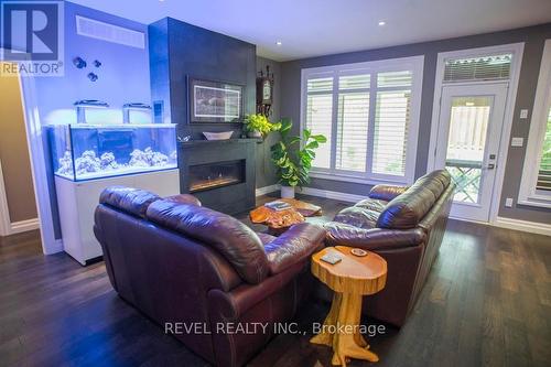 10 - 23 Cedar Street, Brant, ON - Indoor Photo Showing Living Room With Fireplace