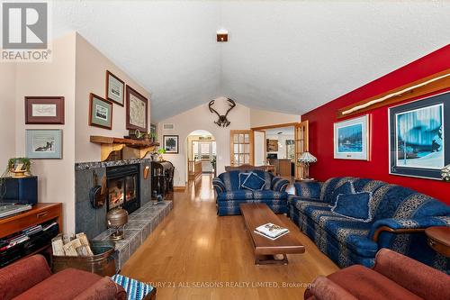 54 Cedar Drive, Hastings Highlands, ON - Indoor Photo Showing Living Room With Fireplace