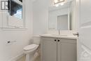 powder room with quartz counter and upgraded floor tile - 723 Odyssey Way, Ottawa, ON  - Indoor Photo Showing Bathroom 