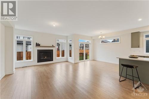 Open concept main floor with gas burning fireplace - 723 Odyssey Way, Ottawa, ON - Indoor Photo Showing Living Room With Fireplace