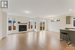 Open concept main floor with gas burning fireplace - 