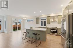 Kitchen with Island workspace with quartz counters - 