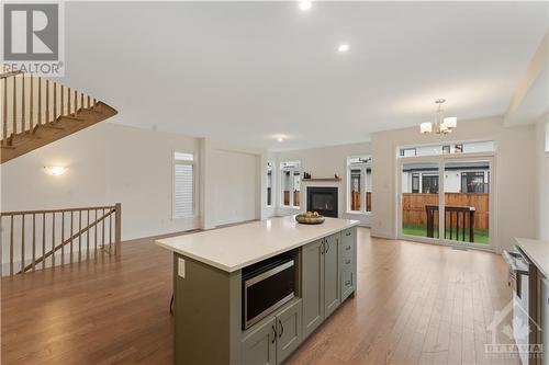 Kitchen island with microwave shelf - 723 Odyssey Way, Ottawa, ON - Indoor Photo Showing Kitchen