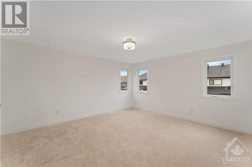 Primary bedroom with upgraded carpet - 723 Odyssey Way, Ottawa, ON - Indoor Photo Showing Other Room