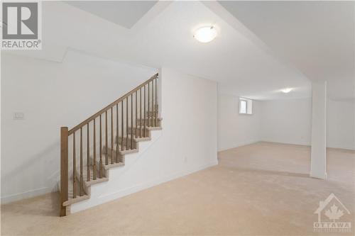 Stairs entering finished basement - 723 Odyssey Way, Ottawa, ON - Indoor Photo Showing Other Room