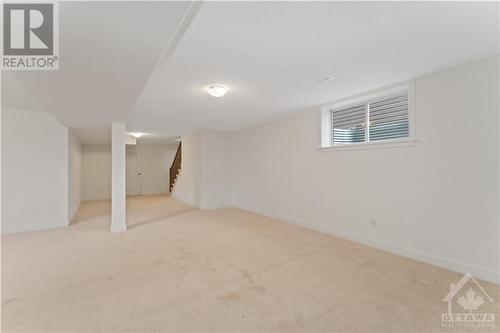 Finished basement with large window for natural light - 723 Odyssey Way, Ottawa, ON - Indoor Photo Showing Other Room