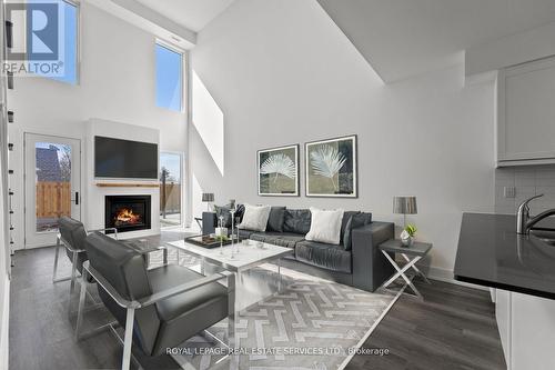 2 - 19 West Street N, Kawartha Lakes, ON - Indoor Photo Showing Living Room With Fireplace