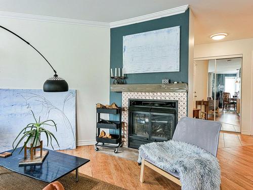 Living room - 102-175 Rue Parent, Longueuil (Greenfield Park), QC - Indoor Photo Showing Living Room With Fireplace