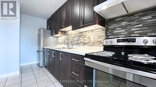 524 - 4060 Lawrence Avenue E, Toronto, ON - Indoor Photo Showing Kitchen With Double Sink With Upgraded Kitchen