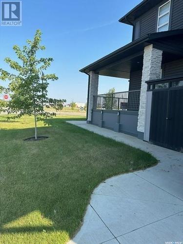 22 254 Brighton Gate, Saskatoon, SK - Outdoor With Deck Patio Veranda