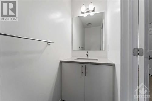 Powder room with quartz countertop - 623 Rathburn Lane, Ottawa, ON - Indoor Photo Showing Bathroom