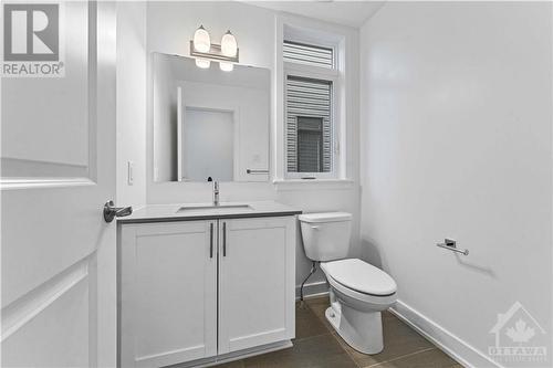 Powder room with quartz counter tops - 705 Rosales Ridge, Ottawa, ON - Indoor Photo Showing Bathroom