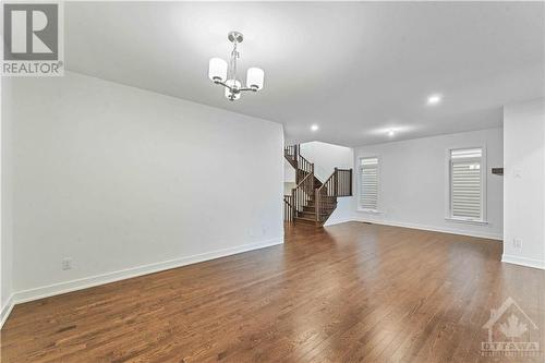 Gleaming hardwood flooring throughout main floor - 705 Rosales Ridge, Ottawa, ON - Indoor Photo Showing Other Room