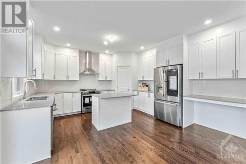 Kitchen has a desk area and comes with quartz counters and all brand new stainless appliances - 705 Rosales Ridge, Ottawa, ON - Indoor Photo Showing Kitchen With Double Sink With Upgraded Kitchen