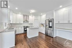 Kitchen has a desk area and comes with quartz counters and all brand new stainless appliances - 