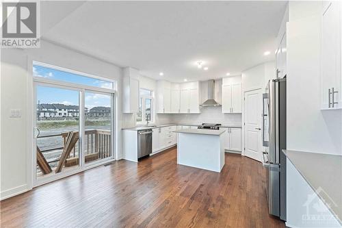 Large patio door off kitchen - 705 Rosales Ridge, Ottawa, ON - Indoor Photo Showing Kitchen With Upgraded Kitchen