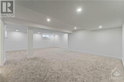 Large finished basement with large windows - 705 Rosales Ridge, Ottawa, ON - Indoor Photo Showing Other Room