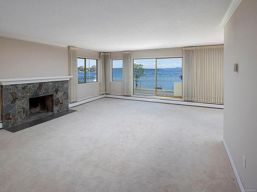 203-1440 Beach Dr, Oak Bay, BC - Indoor Photo Showing Living Room With Fireplace