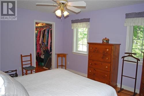 Primary Bedroom has Walk-in Closet - 110 Cottage Lane, Georgian Bluffs, ON - Indoor Photo Showing Bedroom