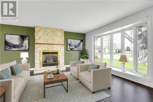 Photo has been virtually staged - 835 Kedrosky Drive, Renfrew, ON - Indoor Photo Showing Living Room With Fireplace