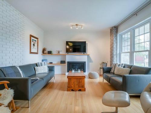 Living room - 389 Rue Frobisher, Saint-Bruno-De-Montarville, QC - Indoor Photo Showing Living Room With Fireplace