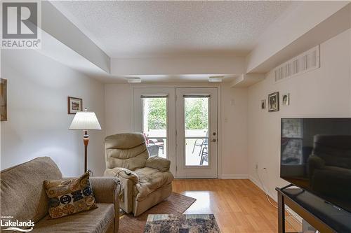 50 Mulligan Lane Unit# 112, Wasaga Beach, ON - Indoor Photo Showing Living Room With Fireplace