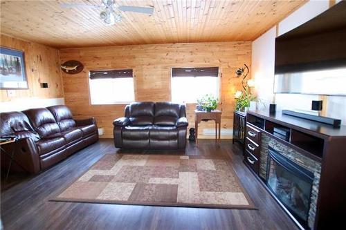 12 Red Deer River Road, Swan River, MB - Indoor Photo Showing Living Room With Fireplace