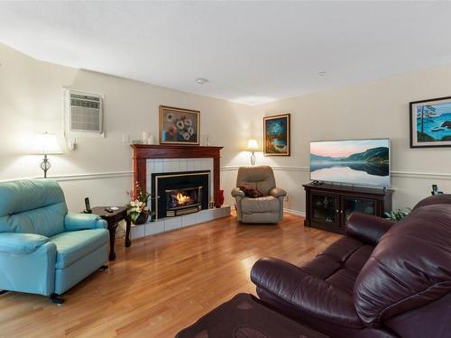 406-1750 Atkinson Street, Penticton, BC - Indoor Photo Showing Living Room With Fireplace