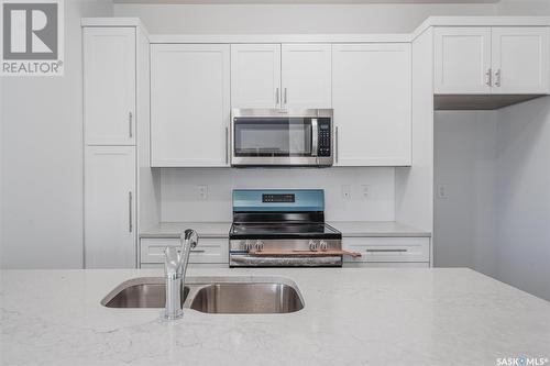 413 L Avenue S, Saskatoon, SK - Indoor Photo Showing Kitchen With Double Sink