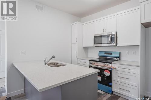 413 L Avenue S, Saskatoon, SK - Indoor Photo Showing Kitchen With Double Sink