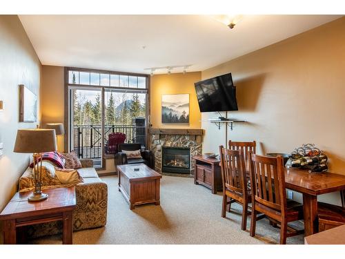 105 - 1549 Kicking Horse Trail, Golden, BC - Indoor Photo Showing Living Room With Fireplace