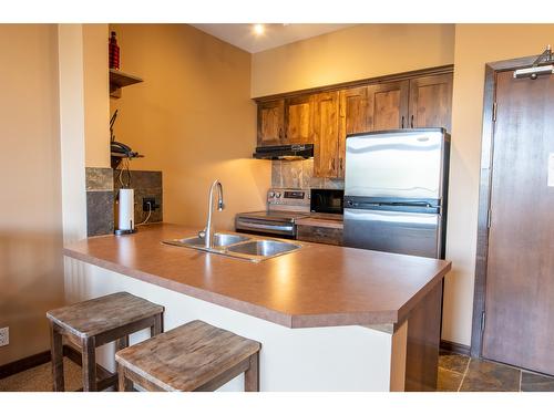 105 - 1549 Kicking Horse Trail, Golden, BC - Indoor Photo Showing Kitchen With Double Sink