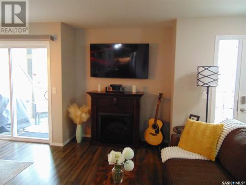212 100 Chaparral Boulevard, Martensville, SK - Indoor Photo Showing Living Room With Fireplace