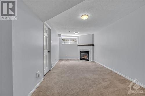 936 Schooner Crescent, Ottawa, ON - Indoor Photo Showing Other Room With Fireplace