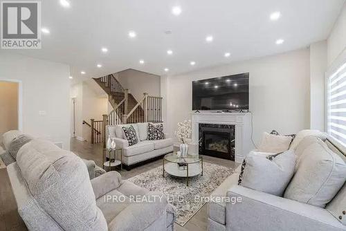95 Kennedy Boulevard, New Tecumseth, ON - Indoor Photo Showing Living Room With Fireplace
