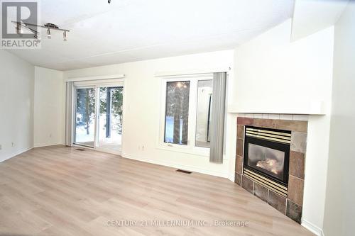 8 - 707 Johnston Park Avenue, Collingwood, ON - Indoor Photo Showing Other Room With Fireplace