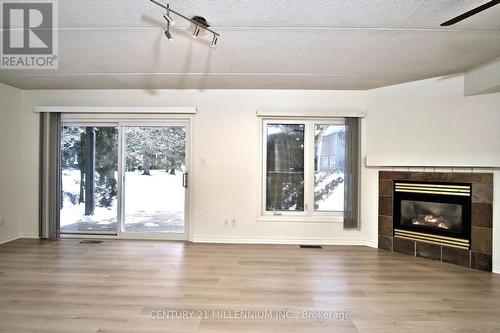 8 - 707 Johnston Park Avenue, Collingwood, ON - Indoor Photo Showing Living Room With Fireplace