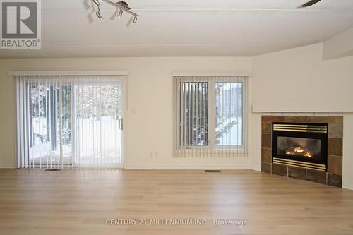 8 - 707 Johnston Park Avenue, Collingwood, ON - Indoor Photo Showing Living Room With Fireplace