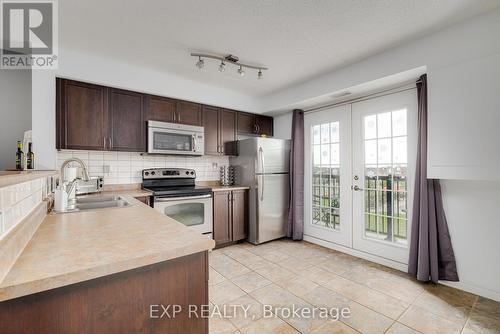 305 - 1390 Main Street E, Milton, ON - Indoor Photo Showing Kitchen With Double Sink