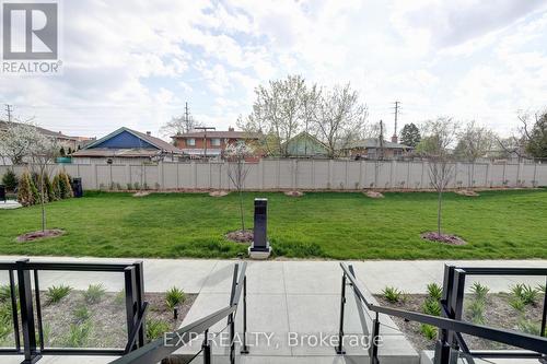 219 - 1070 Douglas Mccurdy Comm Drive E, Mississauga, ON - Outdoor With Backyard