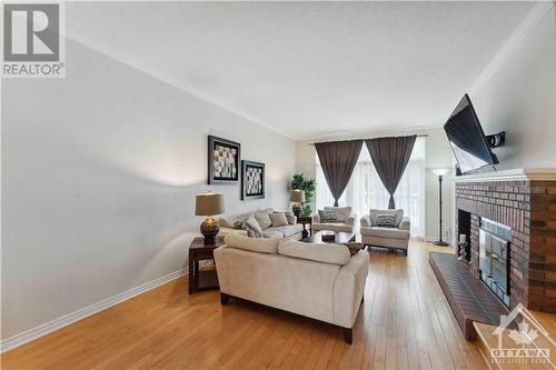25 Rastila Crescent, Ottawa, ON - Indoor Photo Showing Living Room With Fireplace