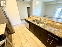 104 71 Riverwood Drive, Weyburn, SK  - Indoor Photo Showing Kitchen With Double Sink 