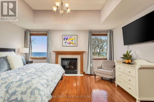 327A Lake Promenade, Toronto, ON - Indoor Photo Showing Bedroom With Fireplace